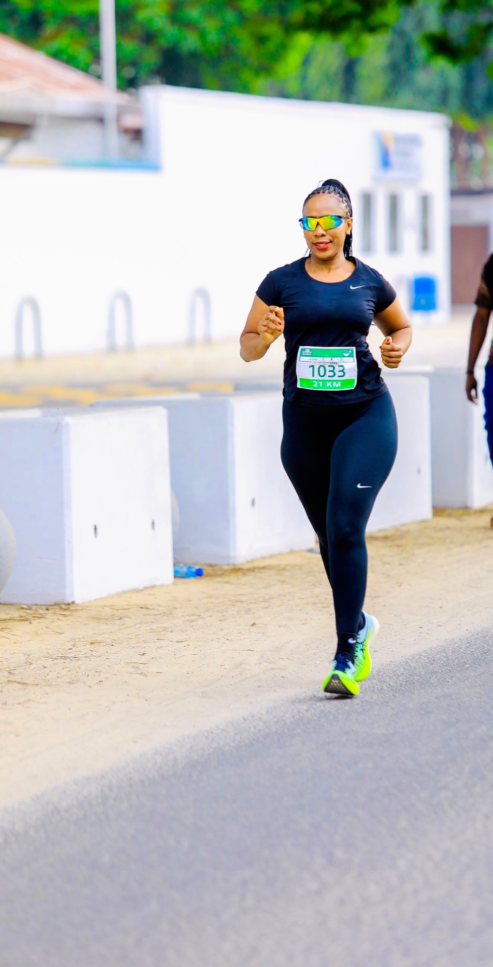Janeth Kimambo racing bib 1033 during a 21km half marathon