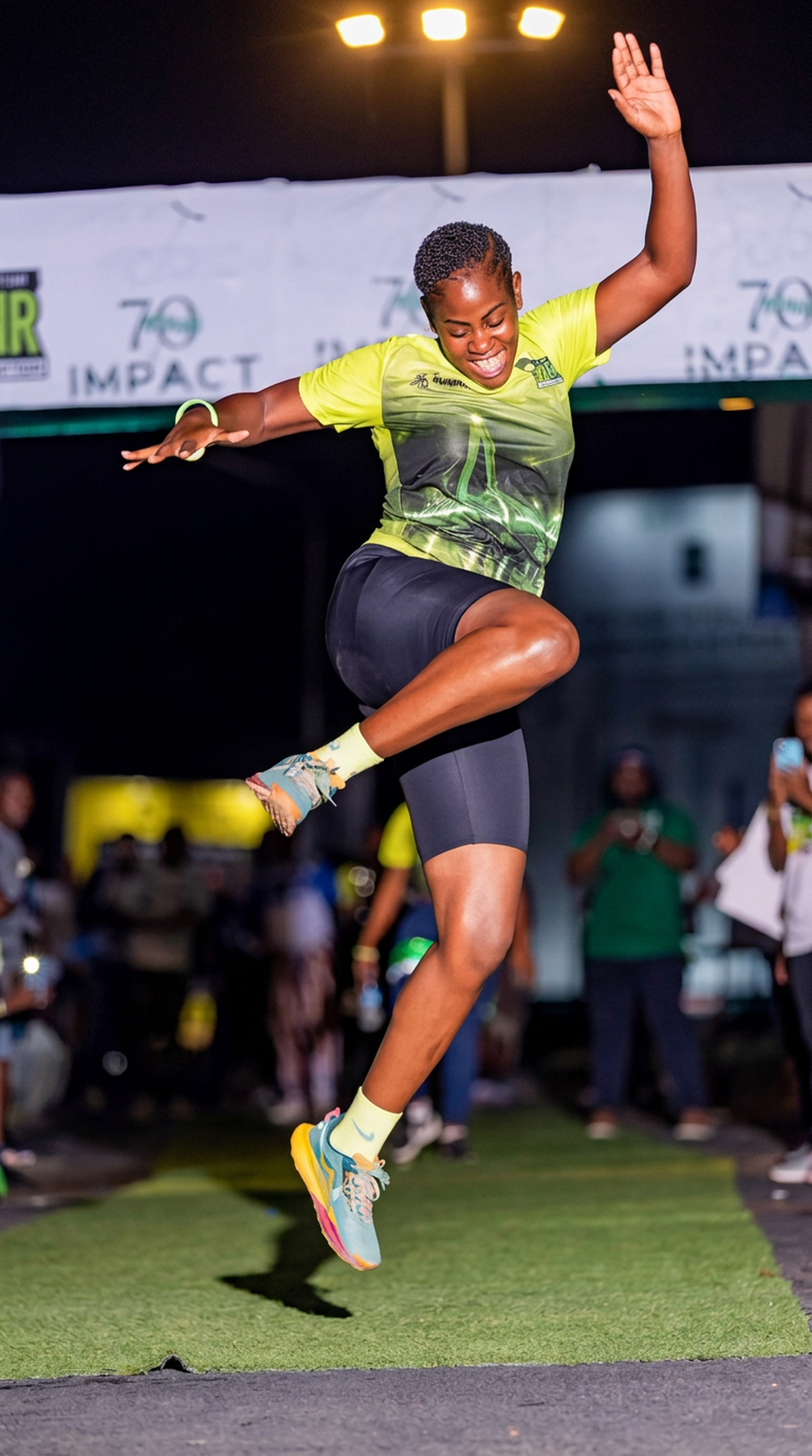 Runner leaping at Dar Night Run 2026